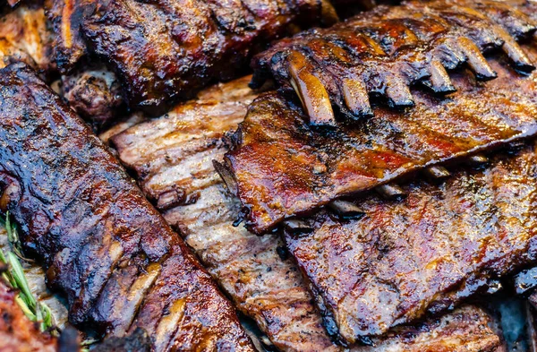 stock image Close-up view on a group of grilled ribs. Juicy tasty BBQ meat