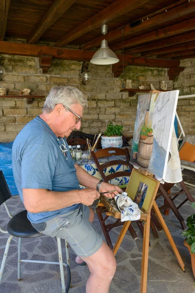 Senior Man painting