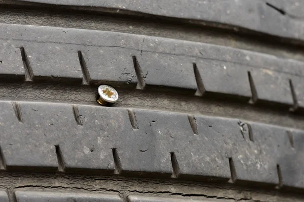 A screw in the tire — Stock Photo, Image
