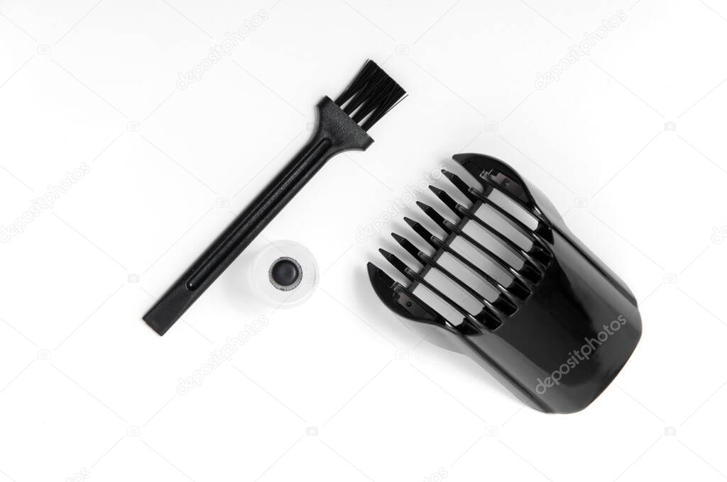 Trimmer, oil and brush on a white isolated background. Beard Care.