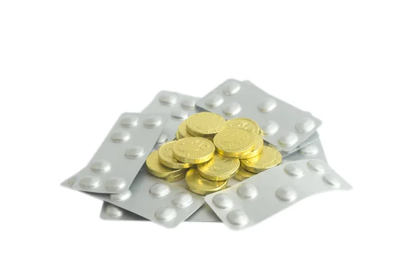 Концепція таблеток і золотих монет . — стокове фото
