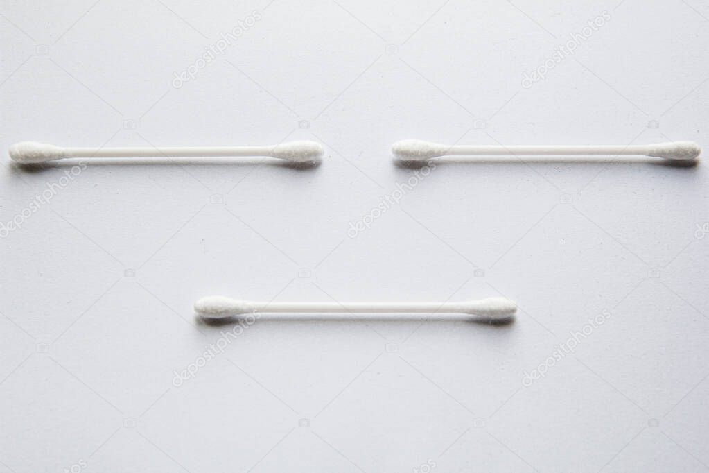 Top view of ear sticks laid out on white background
