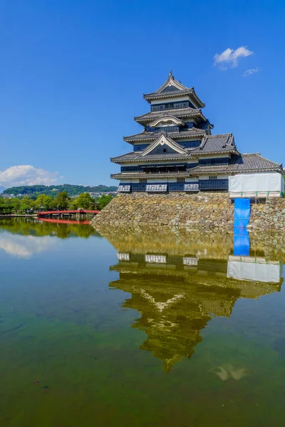 View of the Matsumoto Castle (or Crow Castle) and bridge, in Matsumoto, Japan