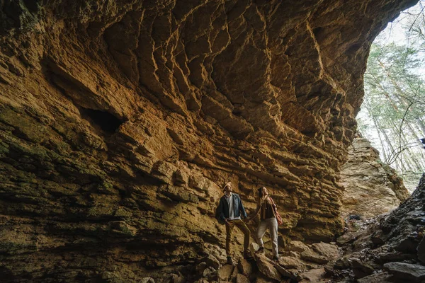 A man and a woman in a cave, a journey