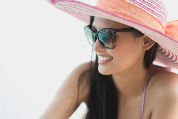 Portrait of gorgeous woman with hat and sunglasses at swimming p