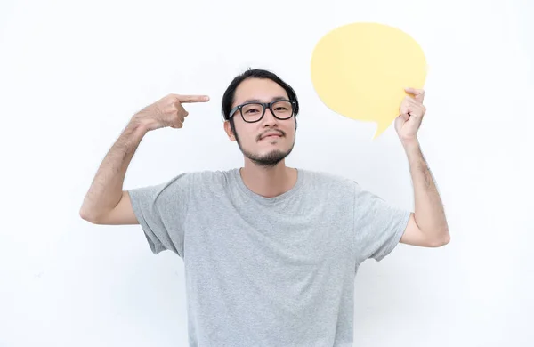 Portrait of a young Asian man in eyeglasses holding empty speech — Stockfoto