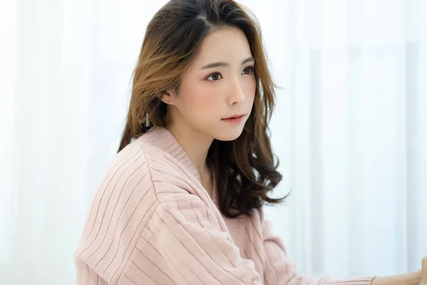 Portrait of beautiful young Asian woman wearing knitted sweater — Stock Photo, Image