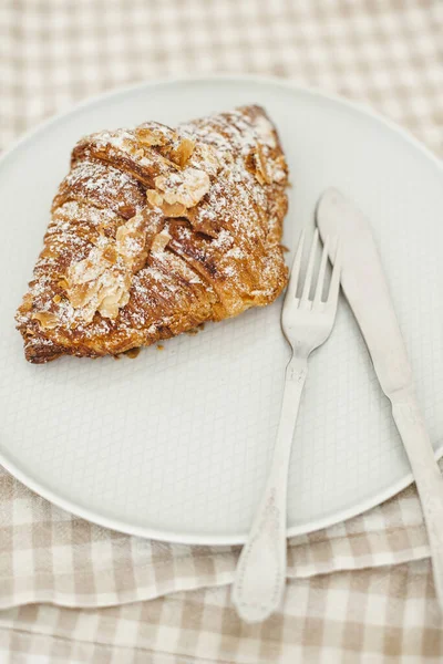 Fresh Almond Croissant Light Plate Fork Knife Sprinkled Powdered Sugar — Stock Photo, Image