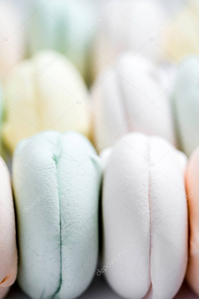 Colored sweet dessert zephyr marshmallows . Air colrful zephyr,, pastel colors. Close up, food photography