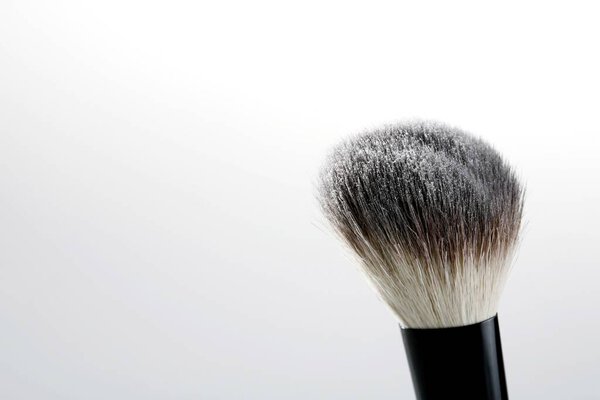 A blusher brush with powder on it
