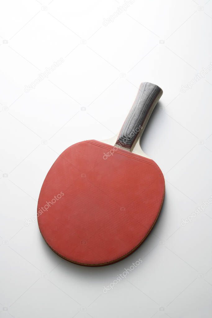 Table tennis bat against white background 
