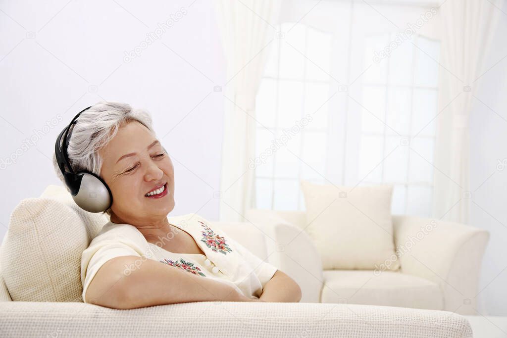 Senior woman listening to headphones