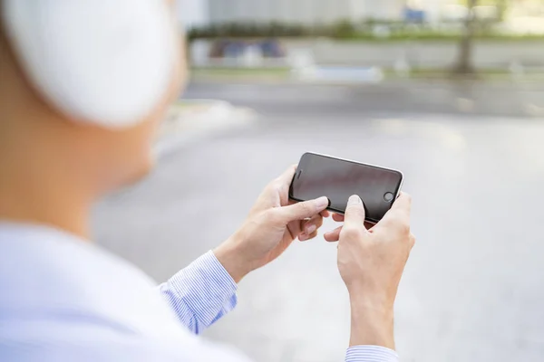 Man playing games on his phone