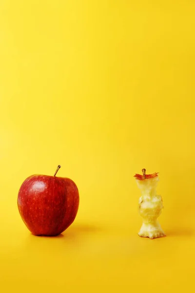 Whole apple and apple core