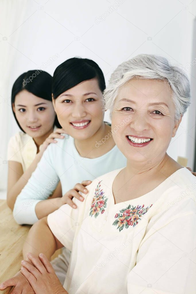 Three women smiling contently