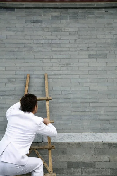 Businessman Climbing Wooden Ladder — Stock Photo, Image