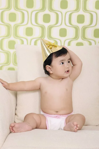 Baby Girl Party Hat Sitting Sofa — Stock Photo, Image