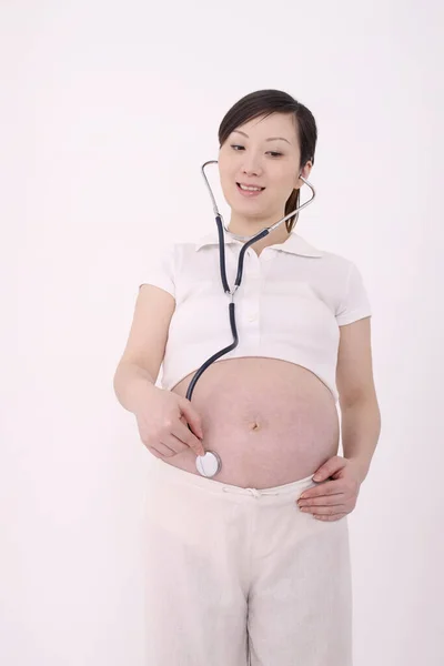 Pregnant Woman Holding Stethoscope Stomach — Stock Photo, Image