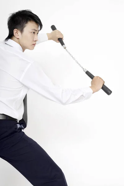 Man Nunchaku Striking Pose — Stock Photo, Image