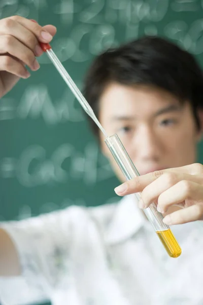 Young Man Measuring Solution Pipette — Stock Photo, Image