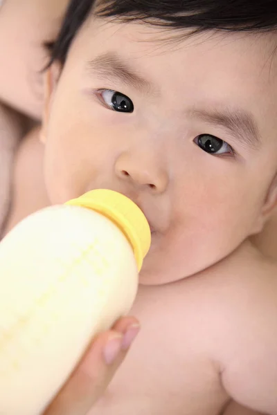 Woman Feeding Baby Girl Milk — Stock Photo, Image