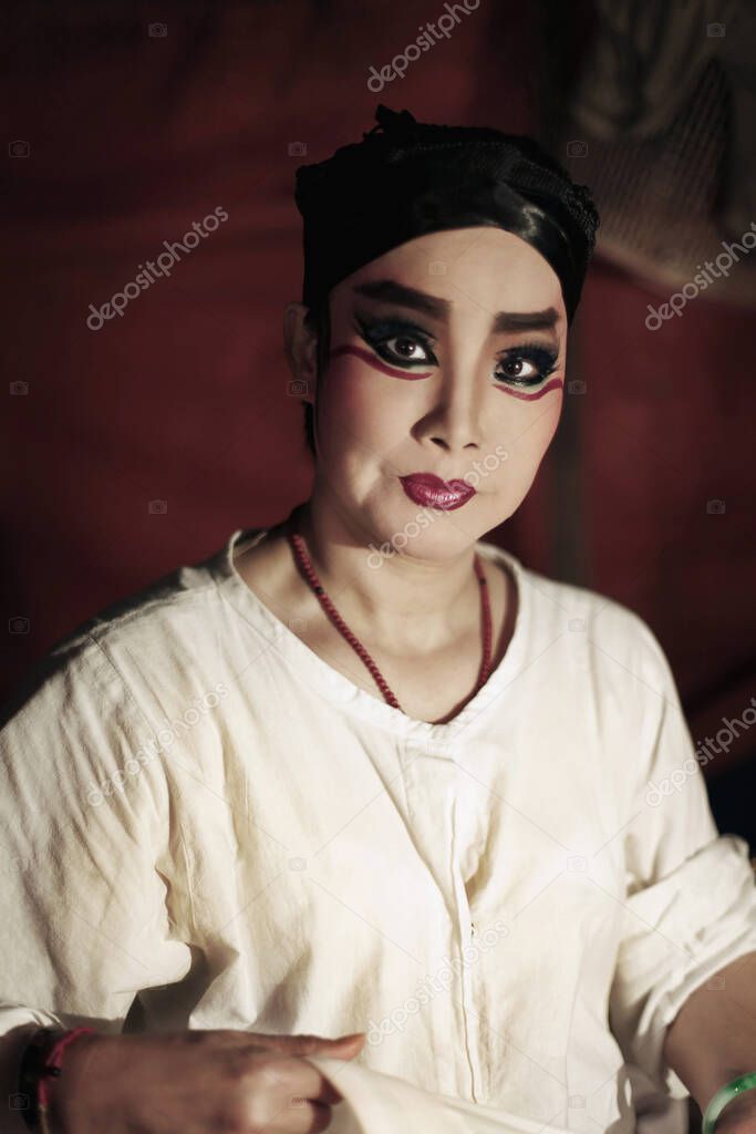 Opera performer with thick make-up