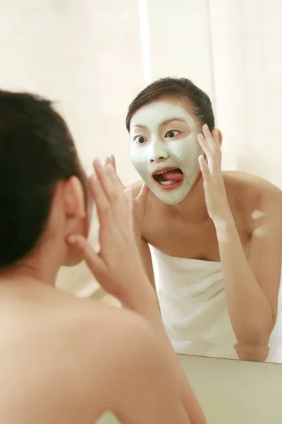 Woman Sticking Her Tongue Out While Looking Herself Mirror — Stock Photo, Image