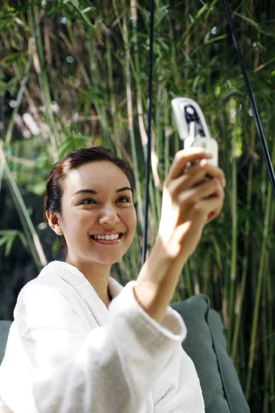 Woman Bathrobe Taking Picture Using Her Mobile Phone — Stock Photo, Image