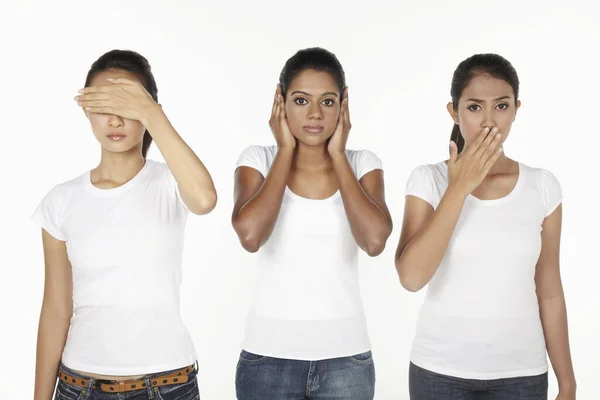 Women portraying the quote, \'See No Evil, Hear No Evil, Speak No Evil\'