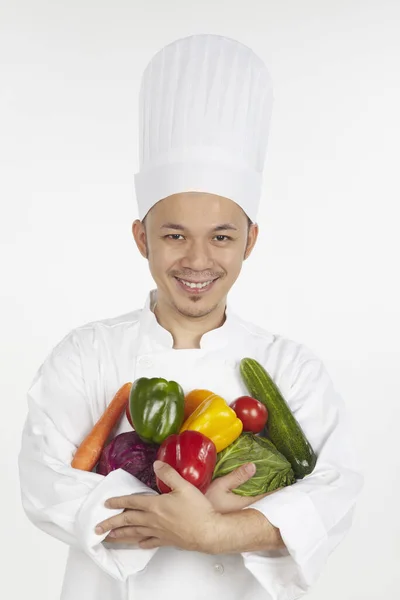 Aziatische Chef Kok Met Een Armvol Groenten — Stockfoto