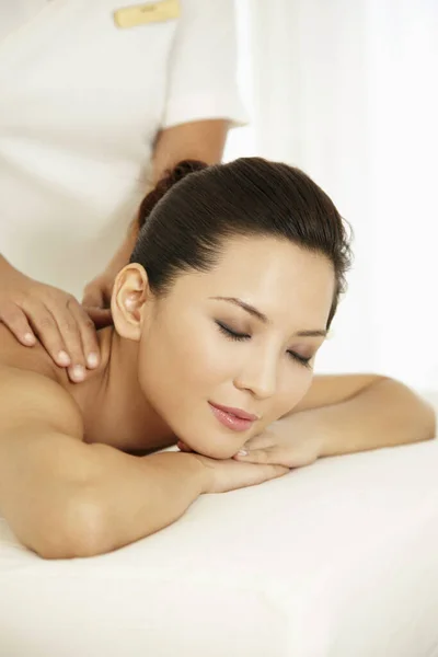Woman Lying Forward Massage Table Her Eyes Closed — Stock Photo, Image