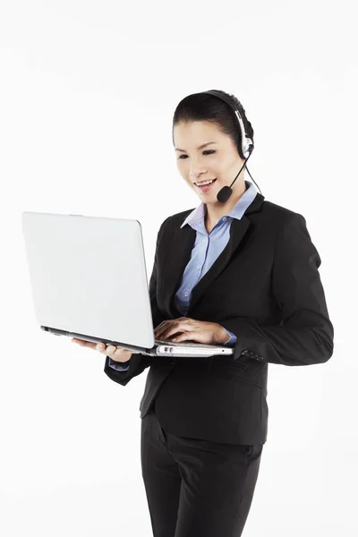 Mid Adult Businesswoman Working Laptop Headset — Stock Photo, Image