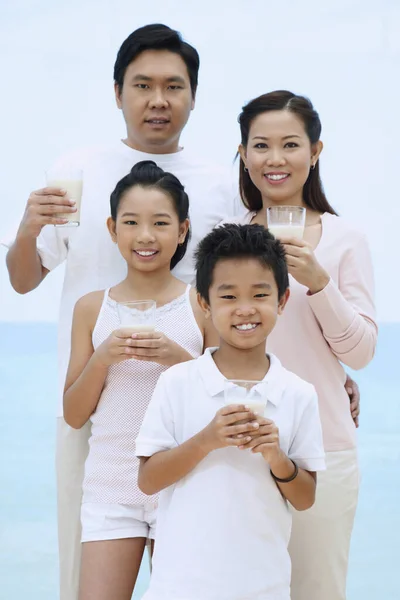 Family with glasses of milk