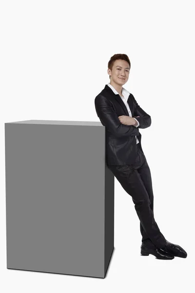 Businessman Leaning Square Cube — Stock Photo, Image