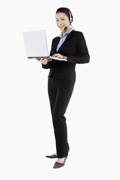 Businesswoman Headphone Standing Holding Laptop — Stock Photo, Image