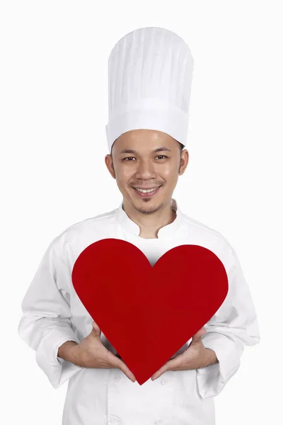 Chef Asiático Sosteniendo Corazón Rojo Recortado —  Fotos de Stock