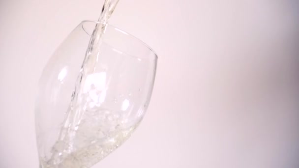 Pouring White Wine Empty Tear Drop Shaped Wine Glass Plain — Stock Video