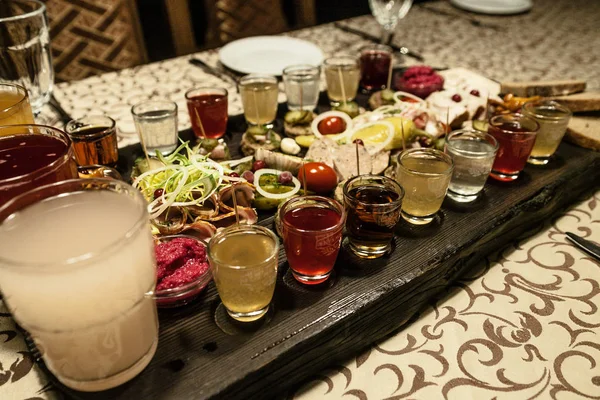 Vodka kvass mors and snacks salted cucumber salo meat — Stock Image Vodka kvass mors and snacks salted cucumber salo meat Royalty Free Stock Photos