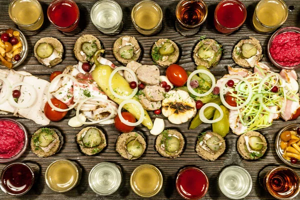 Vodka kvass mors and snacks salted cucumber salo meat — Stock Image Vodka kvass mors and snacks salted cucumber salo meat Stock Photo