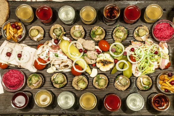 Vodka kvass mors and snacks salted cucumber salo meat — Stock Image Vodka kvass mors and snacks salted cucumber salo meat Royalty Free Stock Images