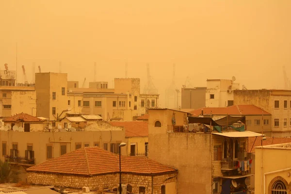 City in the sand storm/dust storm. Architecture of Middle East.