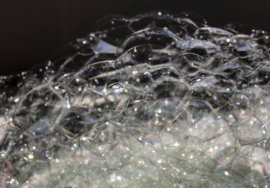 Sabun köpükleri detaylarda kapanır. Soyut arkaplan. 