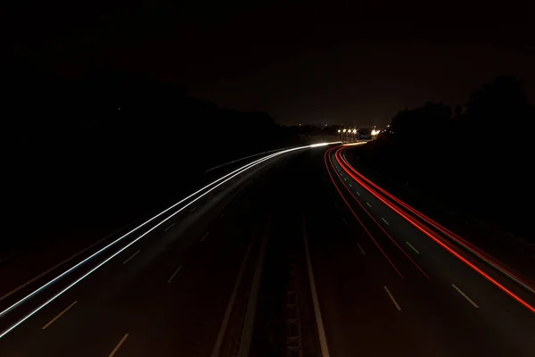 Red and White Car Lights At Highway At Night With Long Shutter Speed on horizontal line