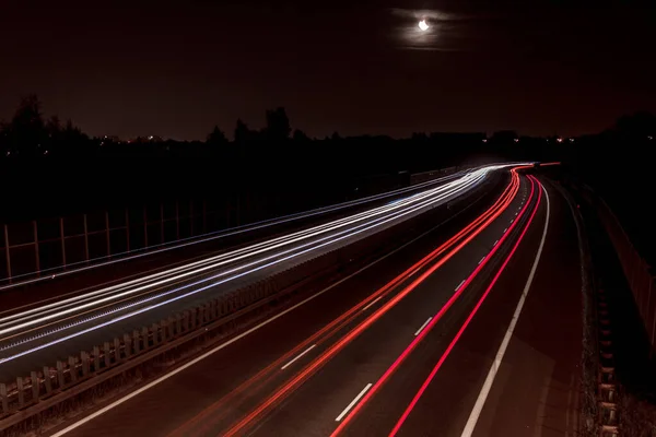 Red and White Car Lights At Highway At Night With Long Shutter Speed on horizontal line