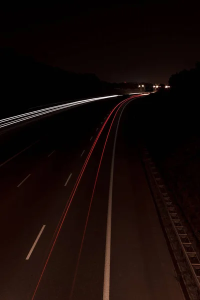 Red and White Car Lights At Highway At Night With Long Shutter Speed on horizontal line