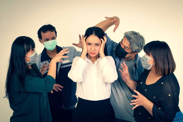 Asian women are scared of the people around them wearing antiviral masks. Covid-19 or coronavirus. The concept of disease prevention and treatment of patients.