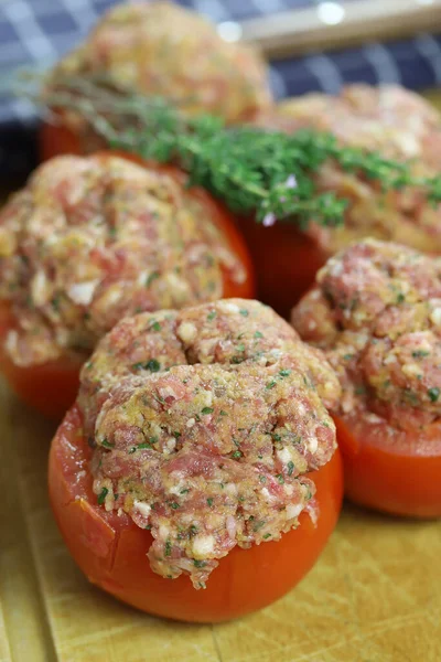 raw stuffed tomatoes on a table