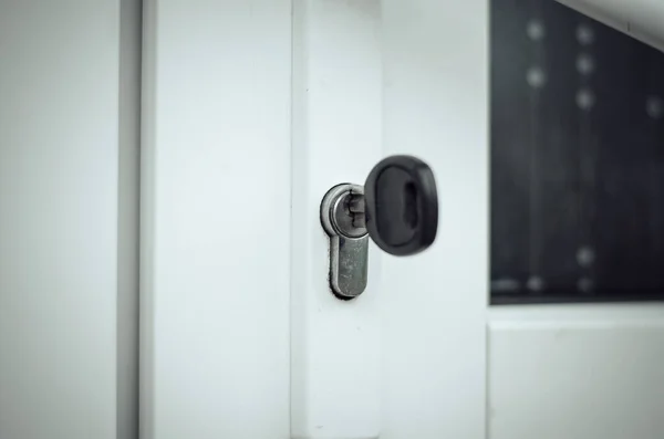 The key is in the door lock of the white front door. Buying a new home