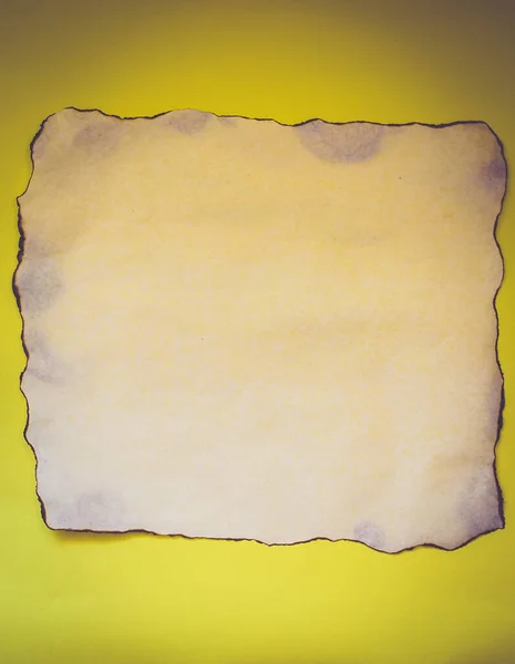 White Sheet Paper Burnt Edges Yellow Background — Stock Photo, Image