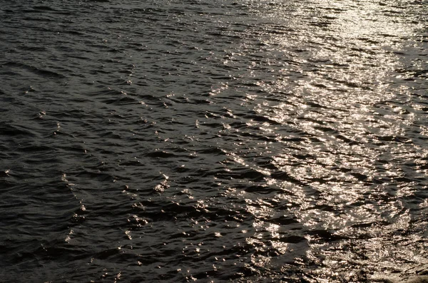 Solar path on the water. The light of the sun falling on the water surface.